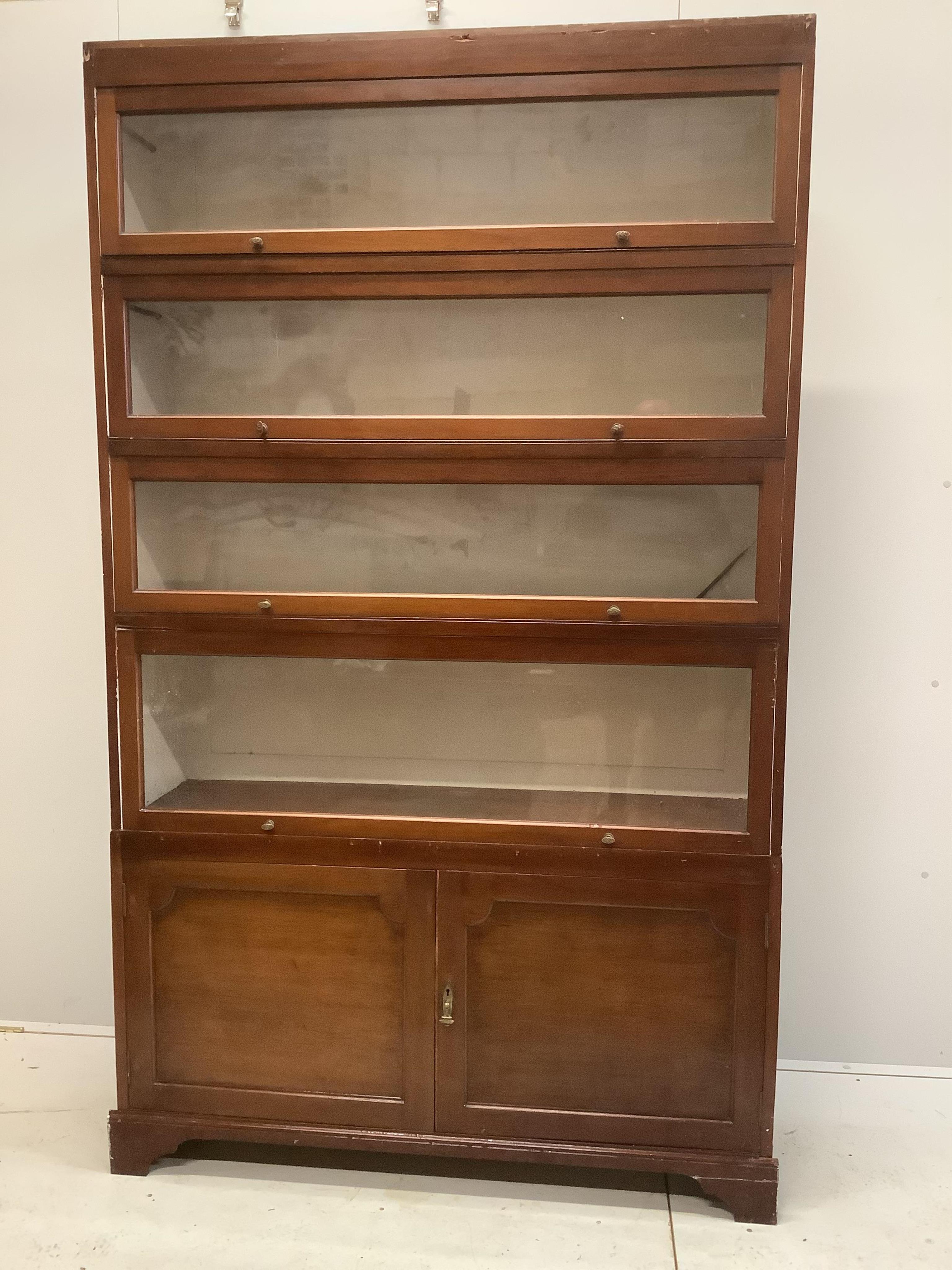 An early 20th century Globe Wernicke style mahogany two section bookcase, width 132cm, depth 34cm, height 207cm. Condition - fair